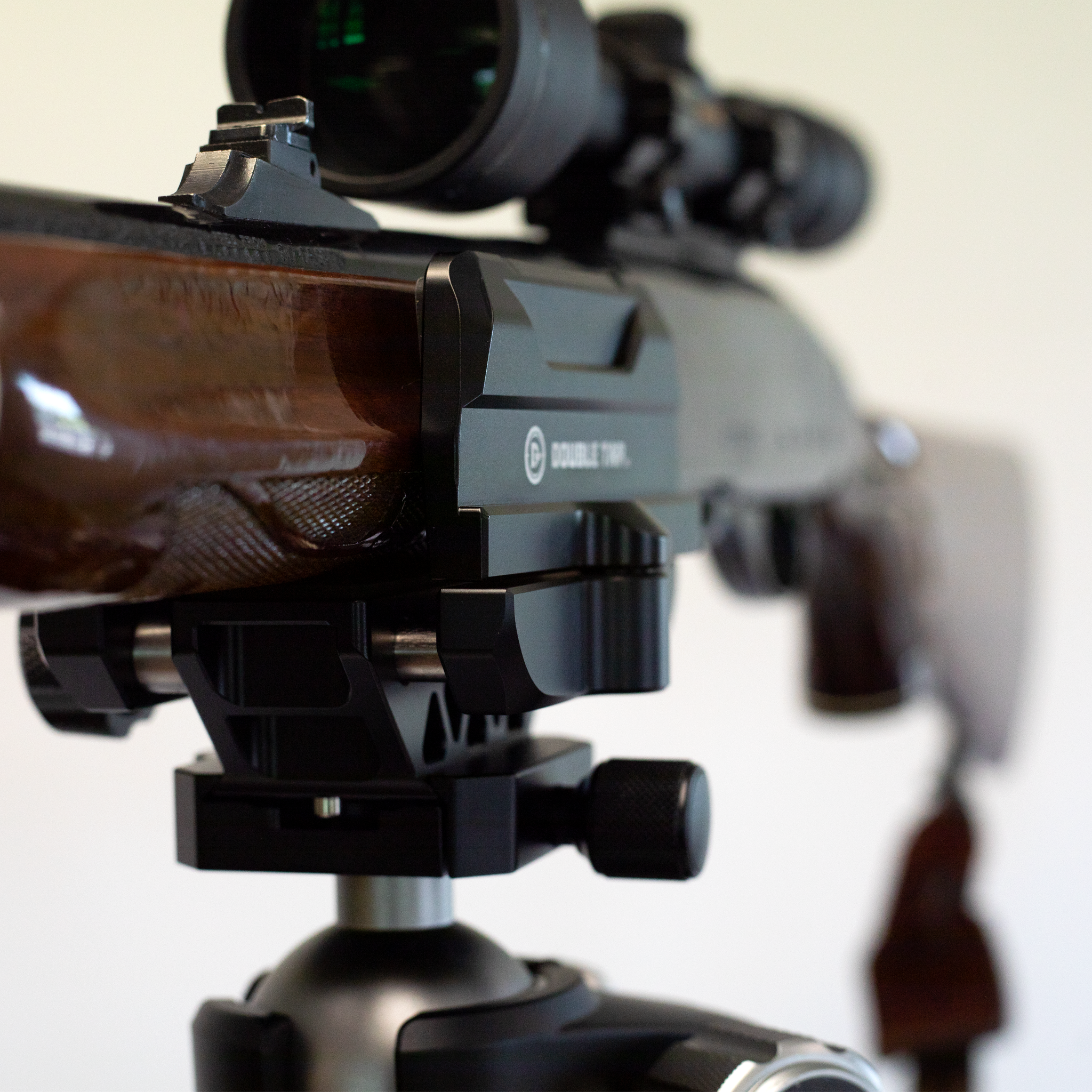 saddle-clamp-on-ball-head-tripod-mount-with-secure-firearm-front-view